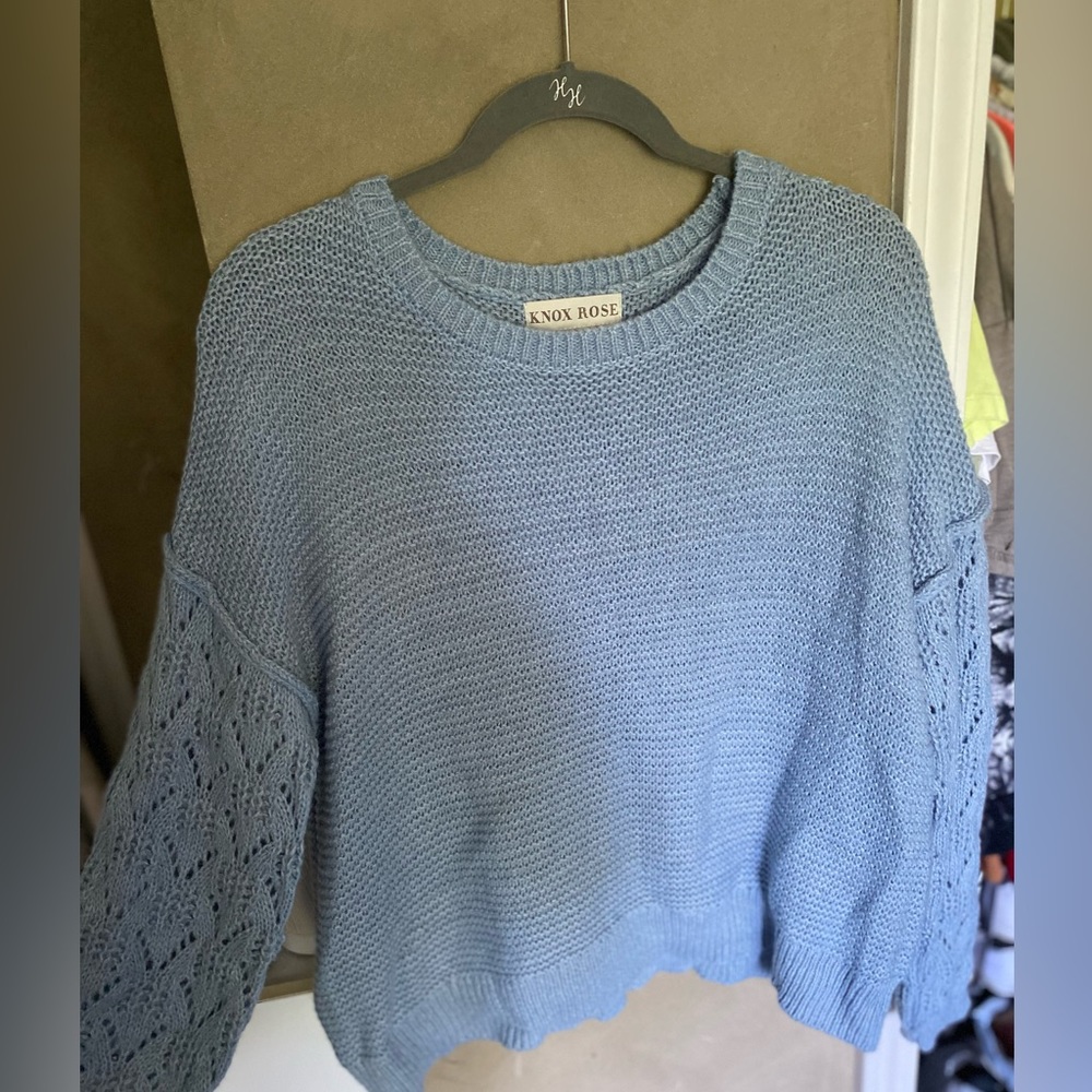 light blue soft felt sweater. 84% acrylic 16% polyester